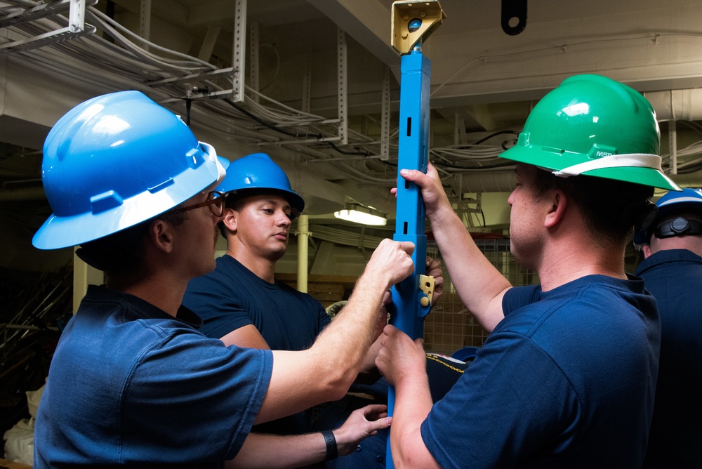 Members aboard Coast Guard Cutter Munro participate in damage control training