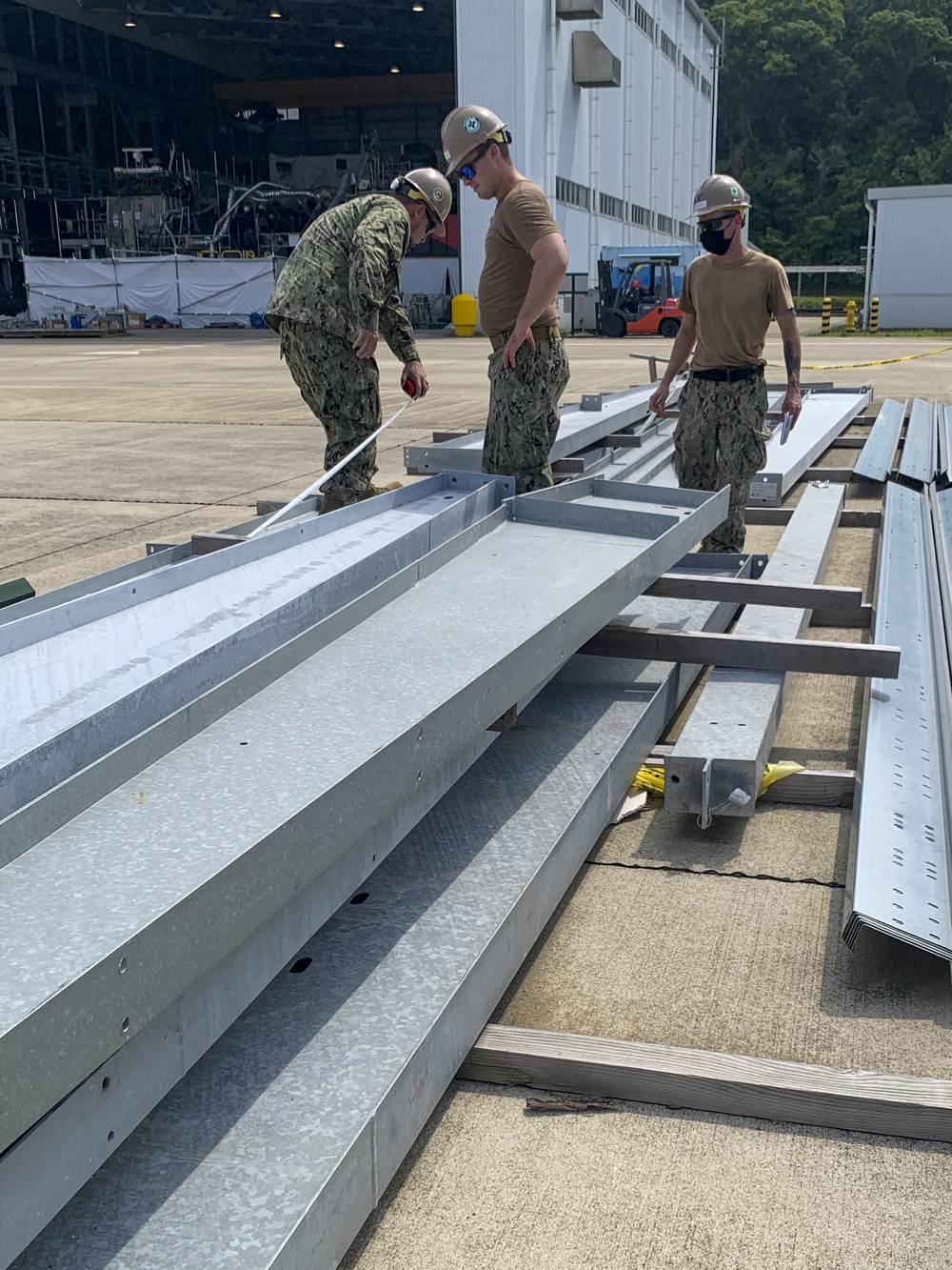 U.S. Navy Seabees with NMCB-5's Detail Sasebo take over from NMCB-4