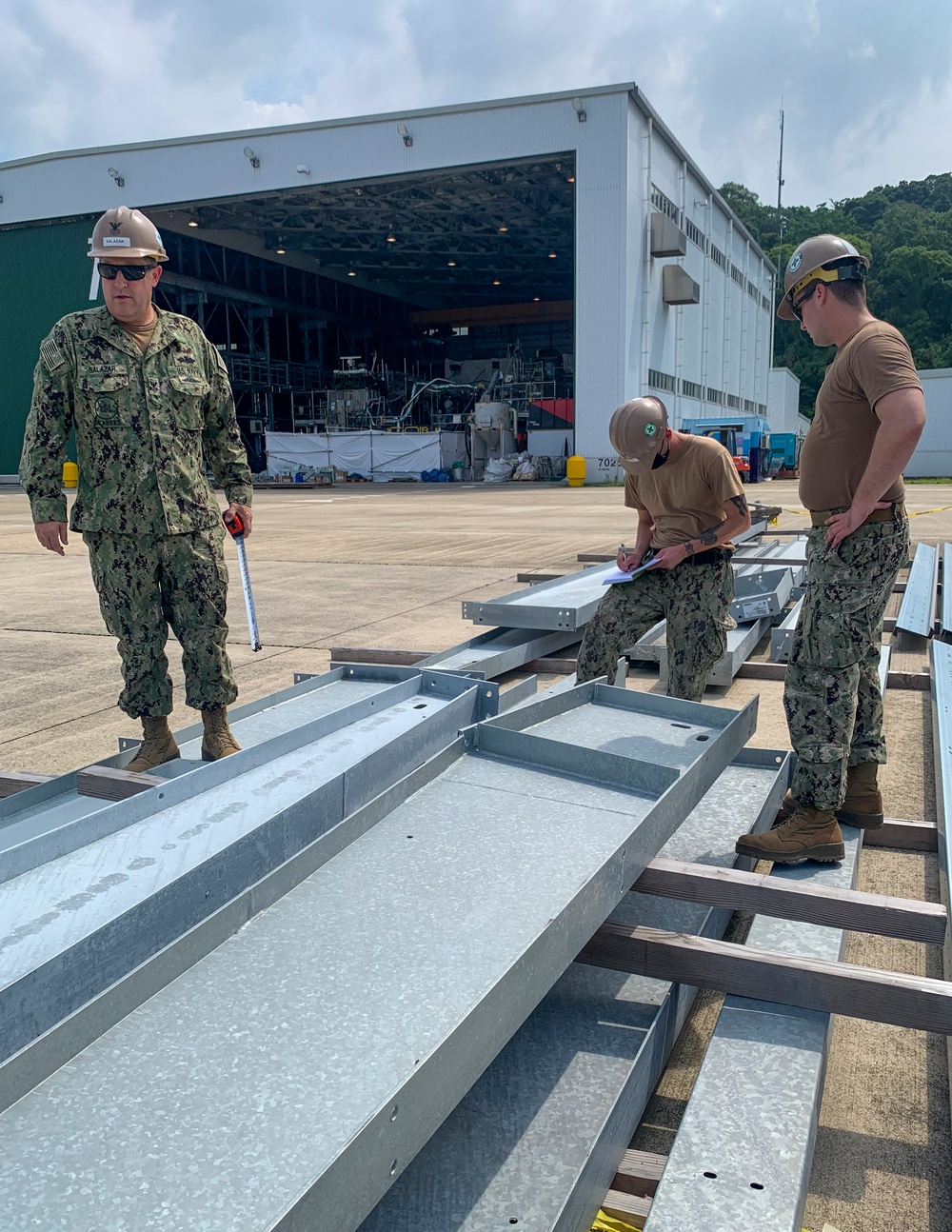 U.S. Navy Seabees with NMCB-5's Detail Sasebo take over from NMCB-4