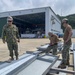 U.S. Navy Seabees with NMCB-5's Detail Sasebo take over from NMCB-4