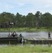 926th EN BDE Boat Team brings a raft to a lengthening bridge
