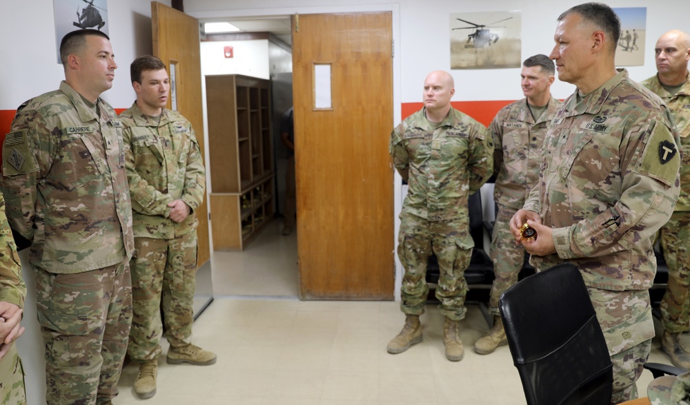 Brig. Gen. Michael Adame and Brig. Gen. Joseph Reale coin Soldiers at Camp Buehring