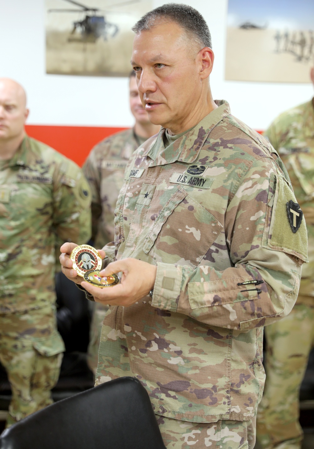 Brig. Gen. Michael Adame and Brig. Gen. Joseph Reale coin Soldiers at Camp Buehring