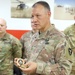 Brig. Gen. Michael Adame and Brig. Gen. Joseph Reale coin Soldiers at Camp Buehring