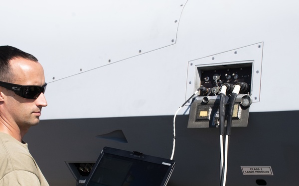 Crewman uploading software to MQ-9 Reaper