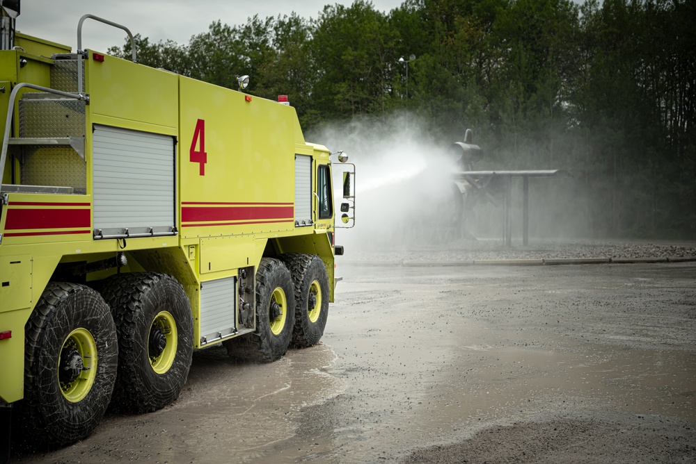 Latvian and Alpena CRTC firefighters simulate aircraft fire