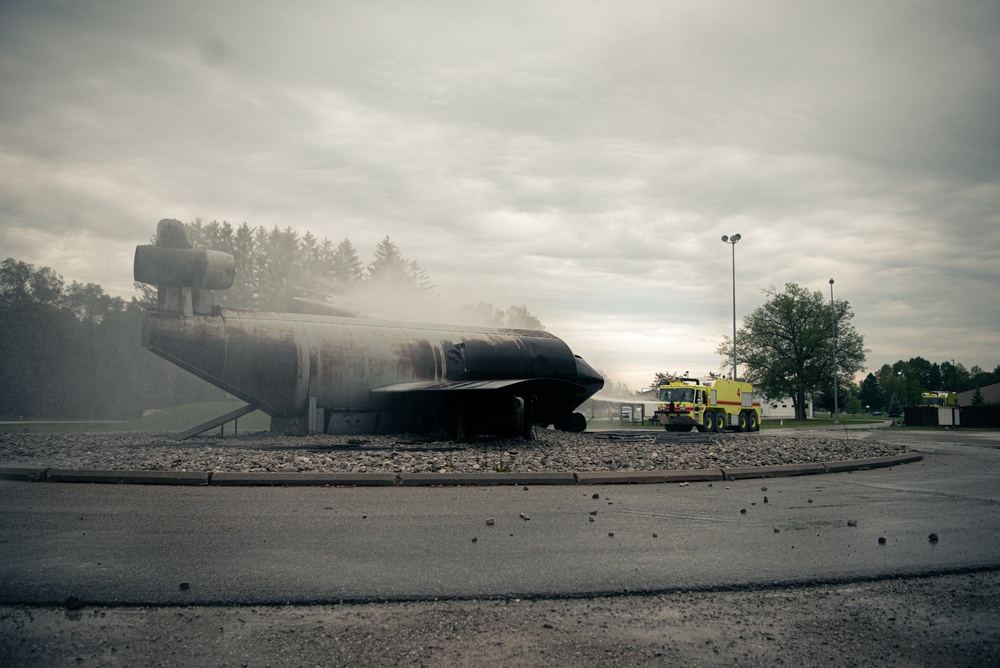 Latvian and Alpena CRTC firefighters simulate aircraft fire