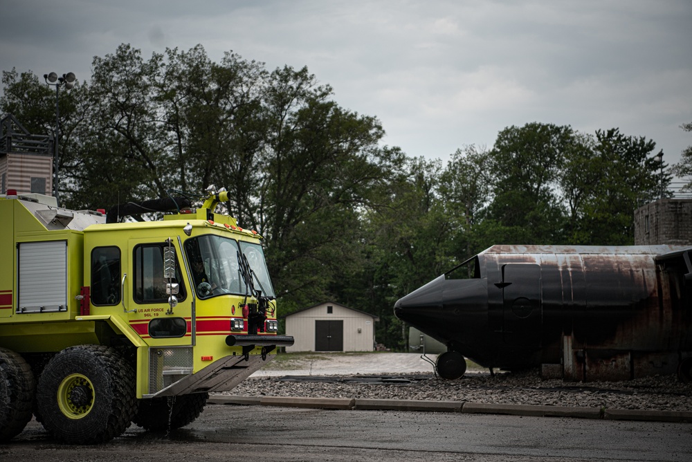 Latvian and Alpena CRTC firefighters simulate aircraft fire