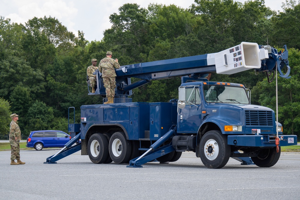 Airmen train on the bucket truck