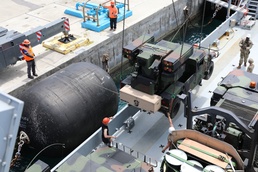 Soldiers Load Avenger Air Defense System onto Army Watercraft System for Forager 21
