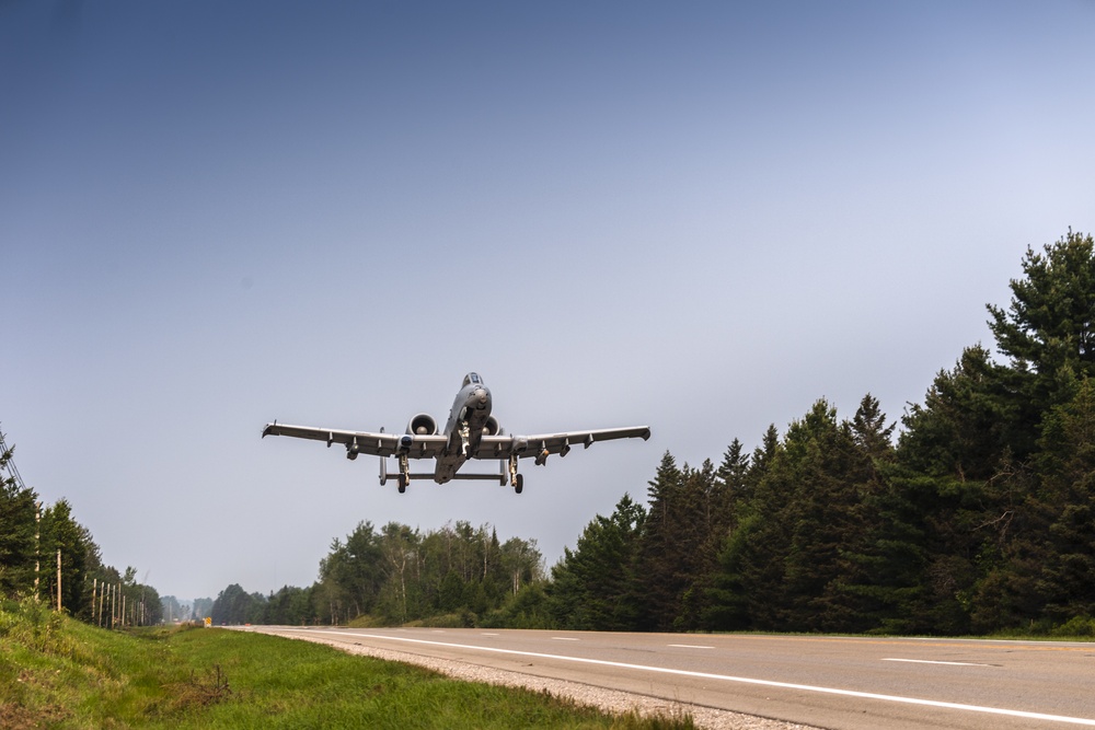Aircraft taking off along highway during Northern Strike 21