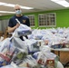 Guam Sailors and Deployed Marines Package Food for Families in Need