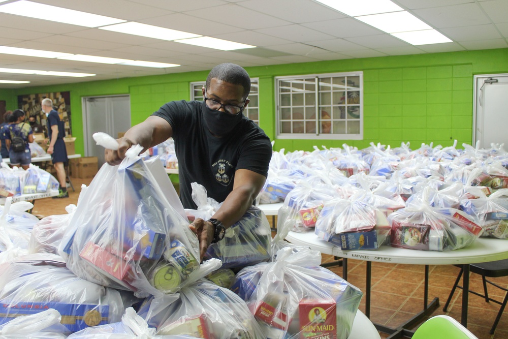 Guam Sailors and Deployed Marines Package Food for Families in Need