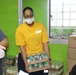 Guam Sailors and Deployed Marines Package Food for Families in Need