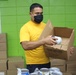 Guam Sailors and Deployed Marines Package Food for Families in Need