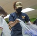 Guam Sailors and Deployed Marines Package Food for Families in Need