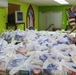 Guam Sailors and Deployed Marines Package Food for Families in Need