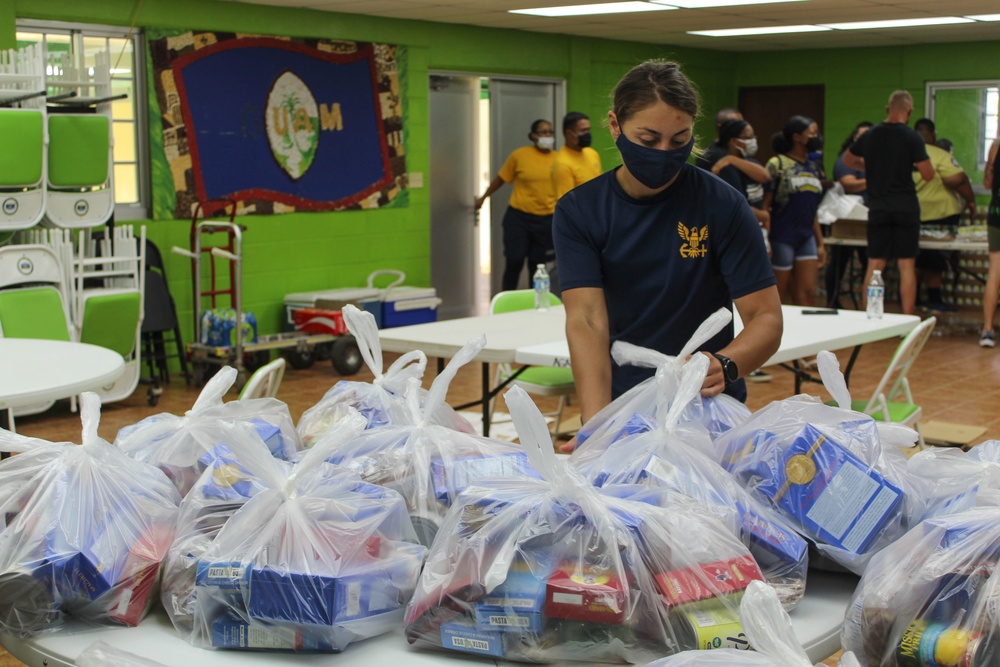 Guam Sailors and Deployed Marines Package Food for Families in Need