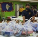 Guam Sailors and Deployed Marines Package Food for Families in Need