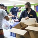 Guam Sailors and Deployed Marines Package Food for Families in Need