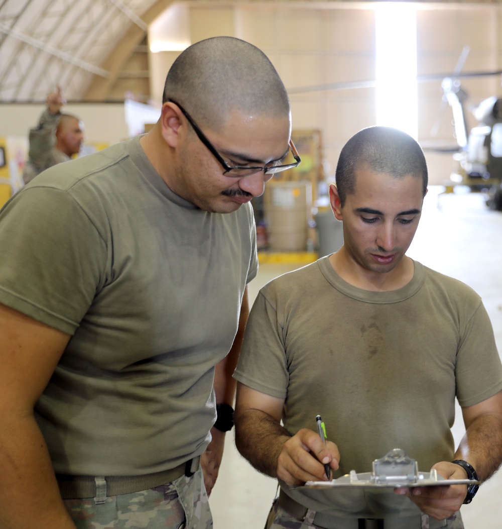 Task Force Phoenix, Bravo Company, 640th Aviation Support Battalion mechanics conducts CH-47 Chinook helicopter maintenance