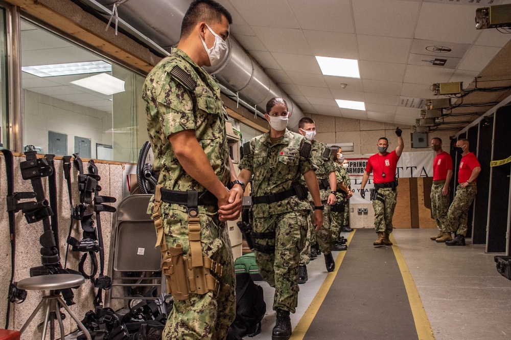210803-N-YF306-0053 NEWPORT, R.I. (August 4, 2021) Armorer directs smalls arms qualification