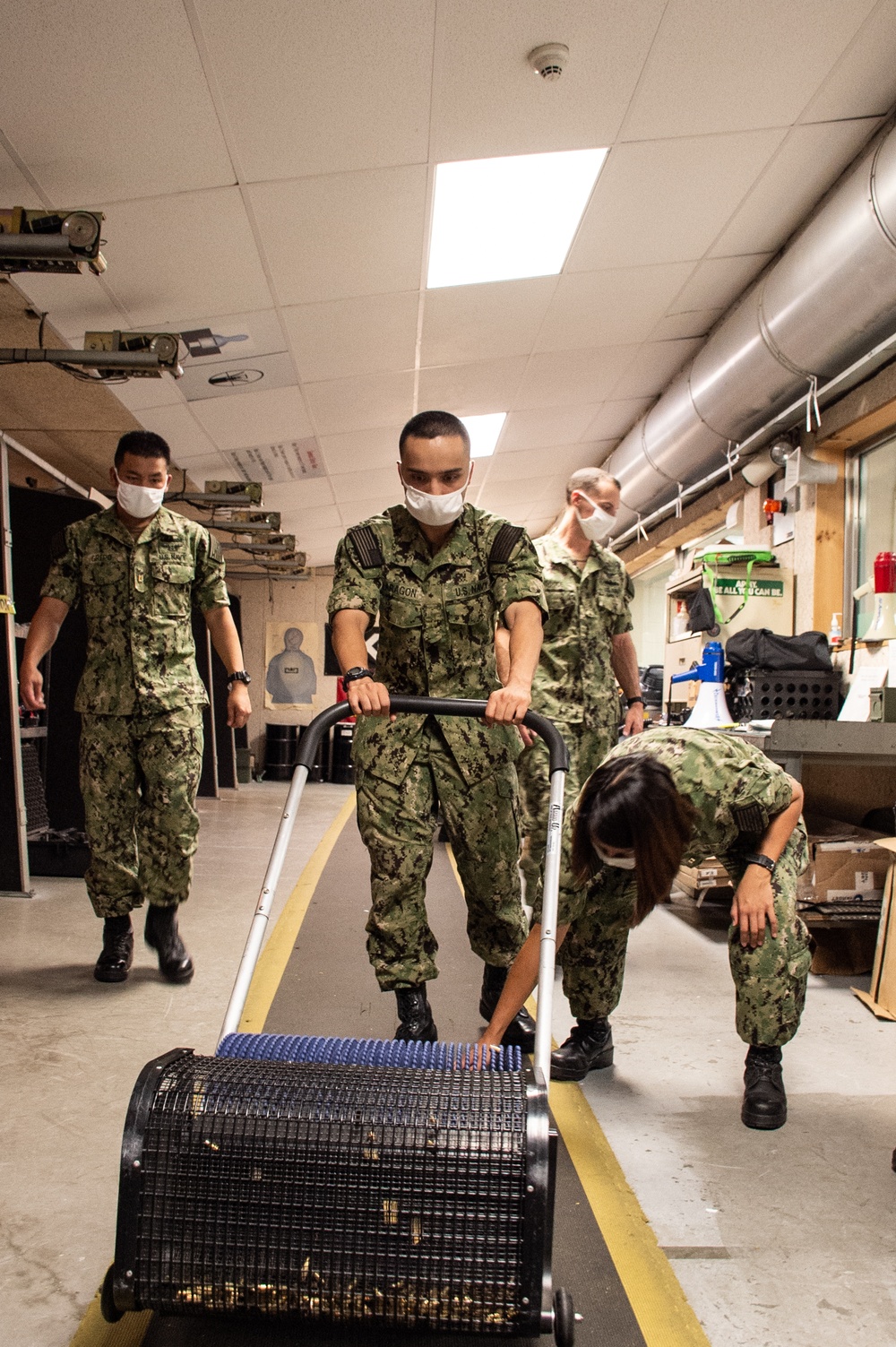210803-N-YF306-0606 NEWPORT, R.I. (Aug. 4, 2021) Officer Candidate Cleans Up After Small Arms Qualification