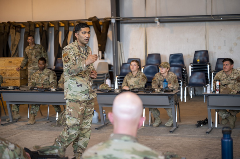 310th commander speaks with 710th Security Forces Squadron during field training