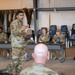 310th commander speaks with 710th Security Forces Squadron during field training