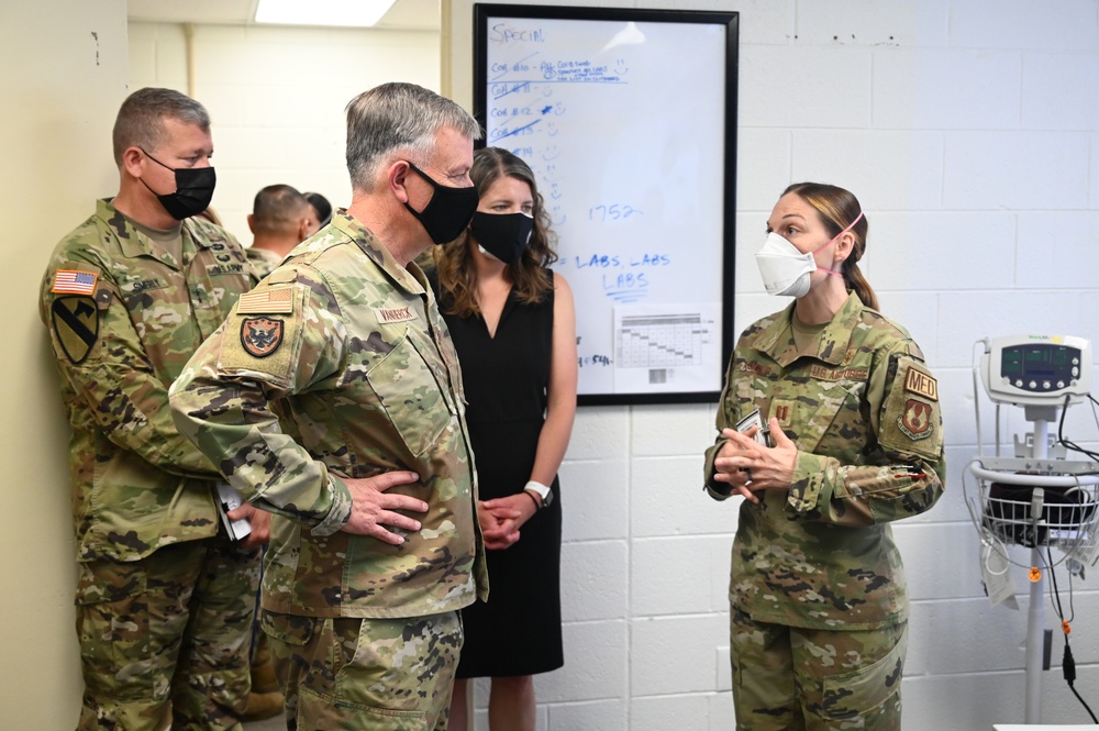 U.S. Air Force Gen. Glen VanHerck, commander of North American Aerospace Defense Command and U.S. Northern Command, receives a tour from Task Force Eagle leadership