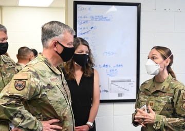 U.S. Air Force Gen. Glen VanHerck, commander of North American Aerospace Defense Command and U.S. Northern Command, receives a tour from Task Force Eagle leadership