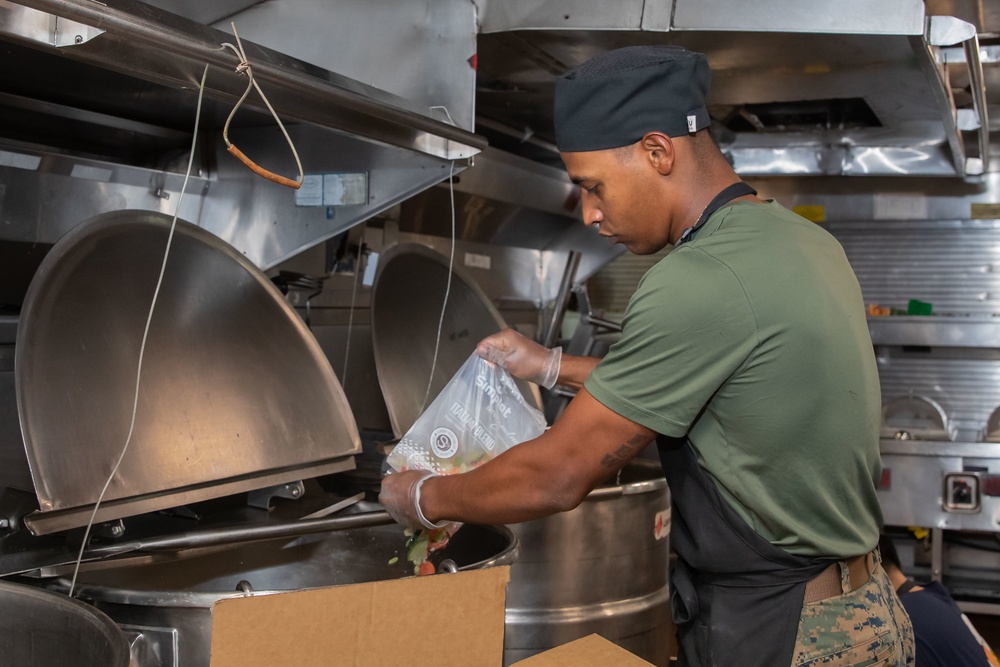 Sailors And Marines Prepare Dinner