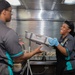 Sailors And Marines Prepare Dinner