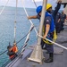 USS Billings Sailors Lower SAR Swimmer Into the Water While Conducting SAR Training