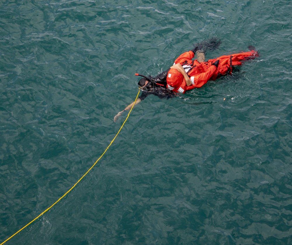 USS Billings Search and Rescue (SAR) Sailor Recovers Dummy During SAR Training