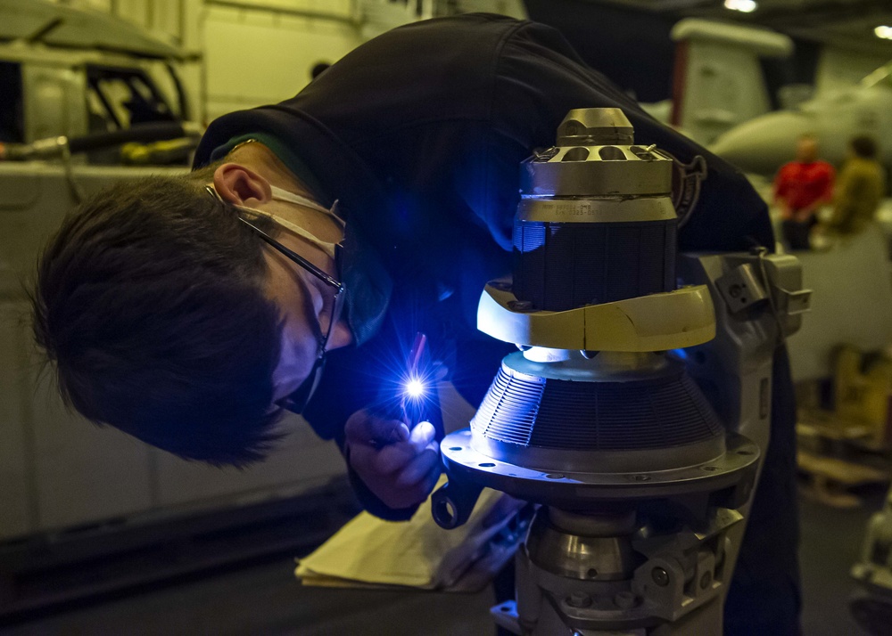 Aviation Machinist’s Mate inspects the spindle of an MH-60S Sea Hawk