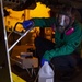 Sailors perform preventative maintenance on F/A-18E Super Hornet