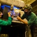 Aviation Structural Mechanic conduct maintenance on an MH-60R Sea Hawk