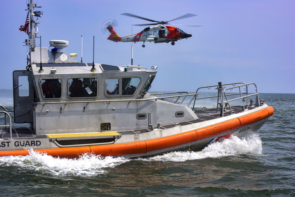 Coast Guard conducts helicopter hoist training off Virginia coast