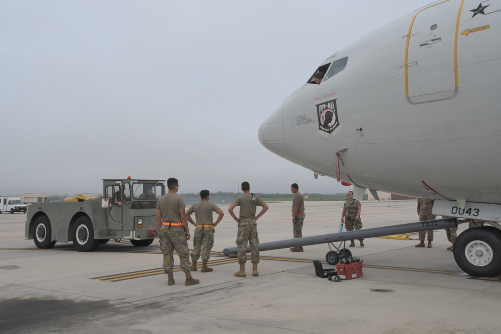 Photo of E-8C Joint STARS Aircraft Entering Hangar