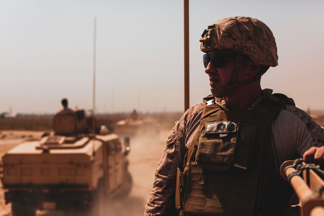 MOHAMMED AL-AHMAD NAVAL BASE, Kuwait (August 2, 2021) A Marine assigned to the 24th Marine Expeditionary Unit (MEU) rides in a tactical vehicle during a subject matter expert exchange with members of the Kuwaiti Armed Forces at Mohammed Al-Ahmad Naval Base, Kuwait, Aug. 2. The 24th MEU is deployed to the U.S. 5th Fleet area of operations in support of naval operations to ensure maritime stability and security in the Central Region, connecting the Mediterranean and Pacific through the western Indian Ocean and three strategic choke points. (U.S. Marine Corps photo by Sgt. Isaiah Campbell)