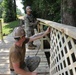 Seabees from NMCB 133 repair walking bridge.