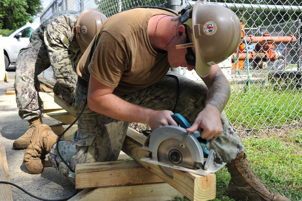 Seabees from NMCB 133 repair and reinforce a foot bridge on board Marine Corps Air Station Cherry Point, NC.