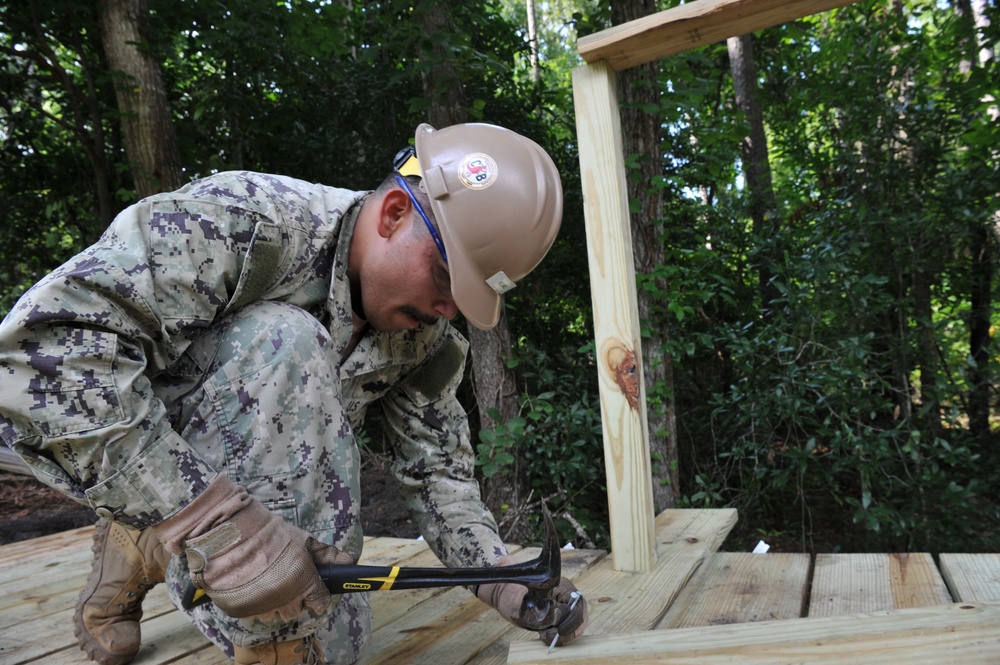 Seabees from NMCB 133 reinforce and repair a foot bridge on board Marine Corps Air Station Cherry Point, NC.