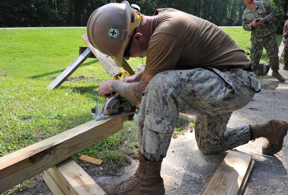 Seabees from Naval Mobile Construction Battalion (NMCB) 133 reinforce and repair a damaged foot bridge on board Marine Corps Air Station Marine Corps Air Station Cherry Point, NC.
