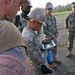 Seabees from NMCB 133 plot the area for a drone to survey in order to locate runway damage and search for possible unexploded ordnance