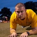 210809-N-YF306-0028 NEWPORT, R.I (Aug. 9, 2021) Officer Candidate Performs Forearm Planks During Physical Readiness Test