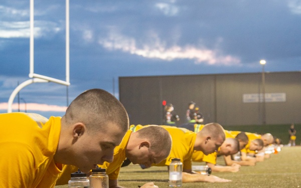 210809-N-YF306-0023 NEWPORT, R.I (Aug. 9, 2021) Officer Candidates Perform Forearm Planks During Physical Readiness Test