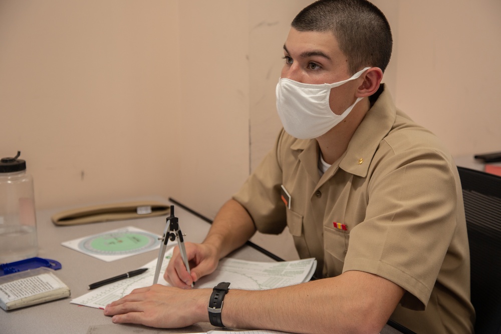 210810-N-YF306-0043 NEWPORT, R.I (Aug. 10, 2021) Officer Candidate Listens During Class