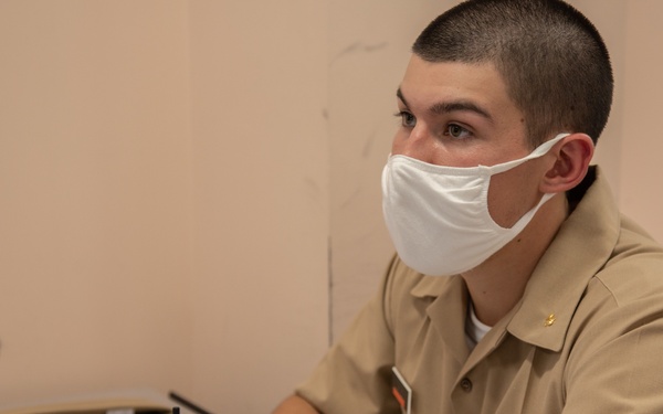 210810-N-YF306-0043 NEWPORT, R.I (Aug. 10, 2021) Officer Candidate Listens During Class